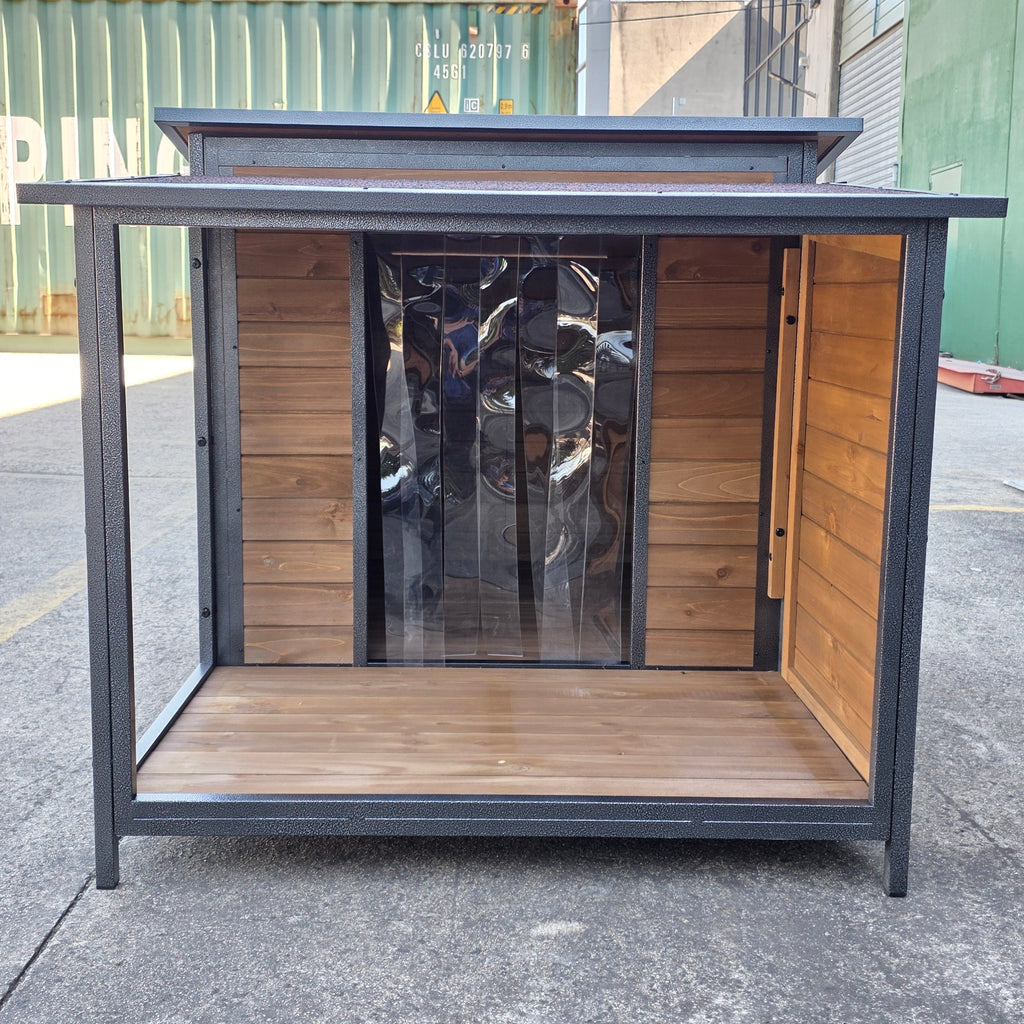 Outdoor furniture piece with wooden seat and metal frame on a concrete surface.