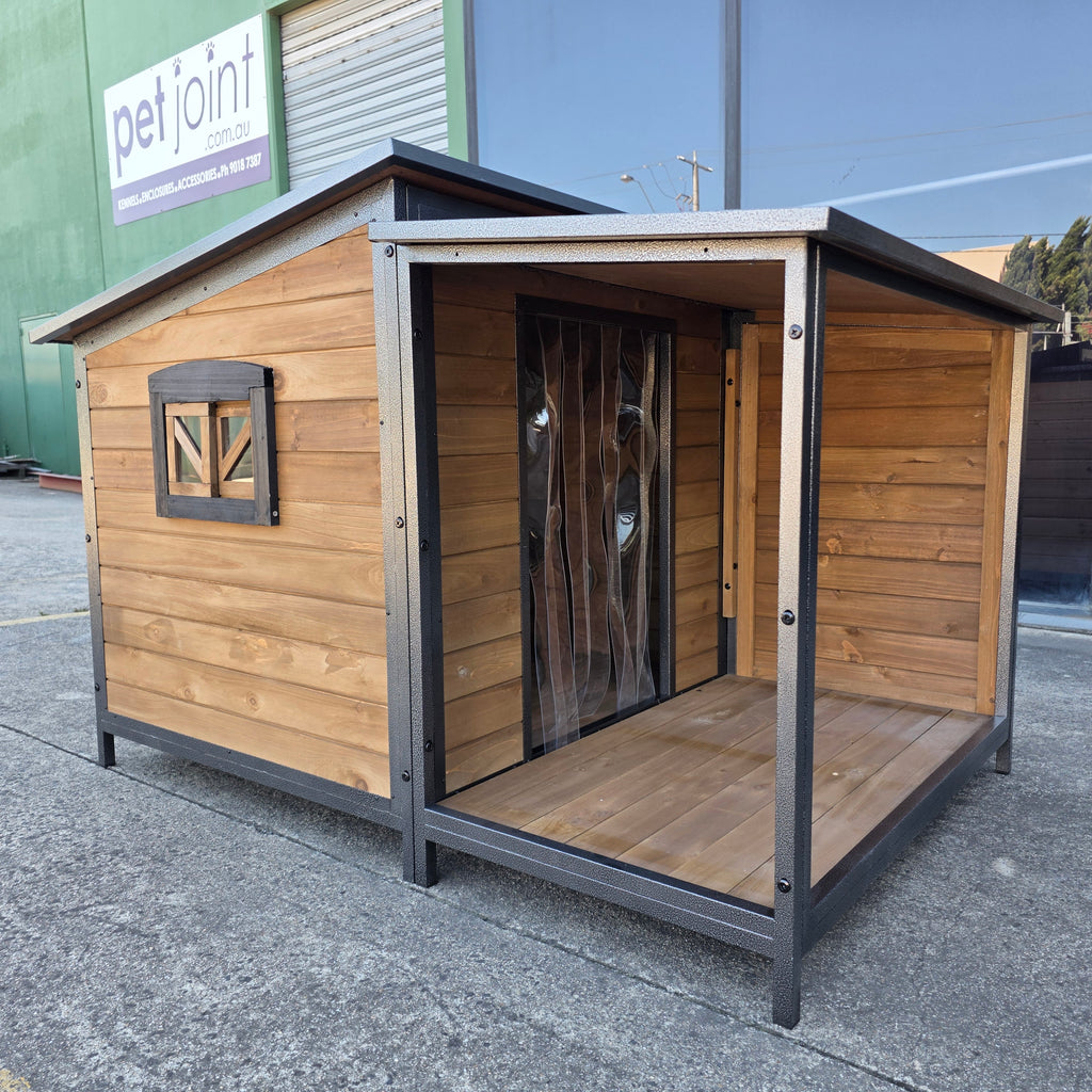 Wooden pet house with metal frame on a concrete surface, brand 'pet joint' visible in the background.